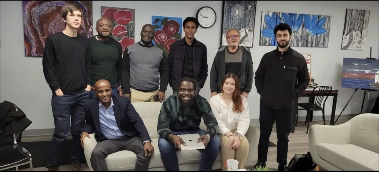 A team gathered for a group photo at an office event